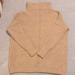 Wide turtleneck ribbed sweater